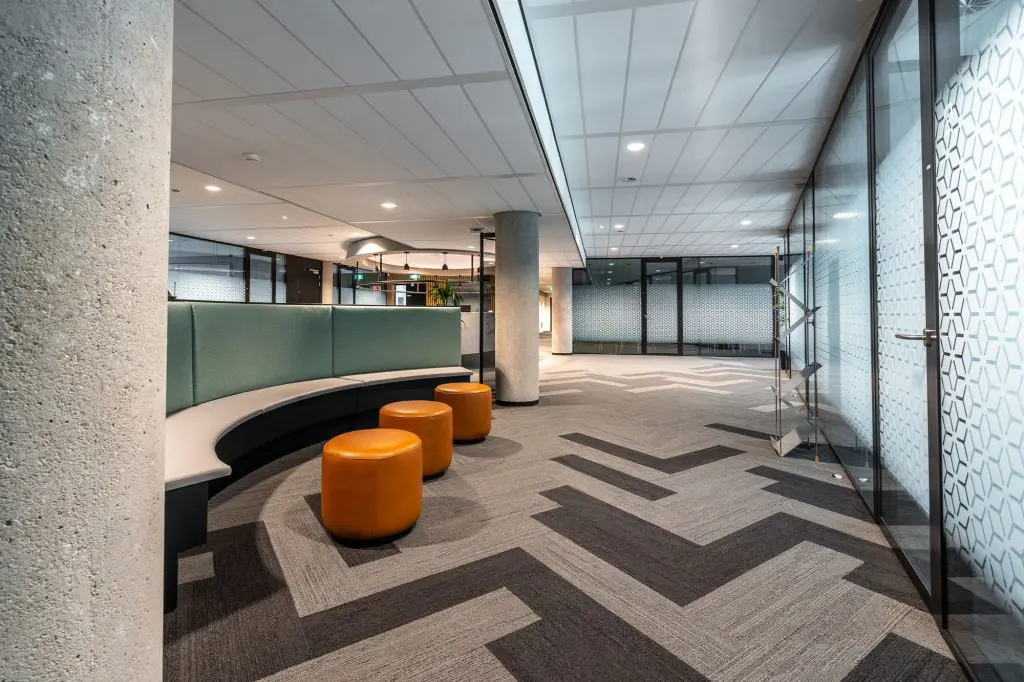 A wide shot of a modern, open concept office interior.