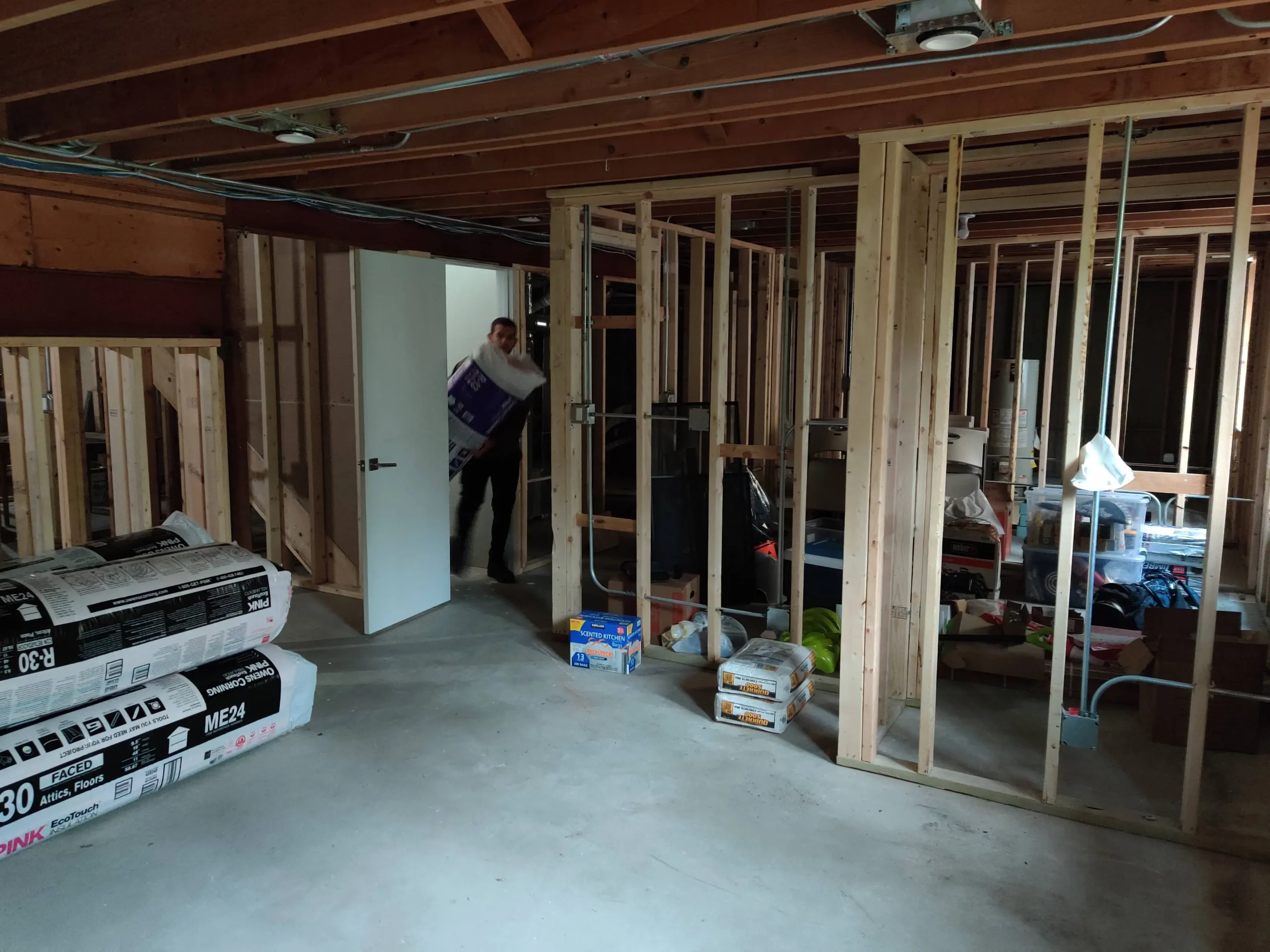 Framed basement walls with insulation delivered for an Evanston remodel