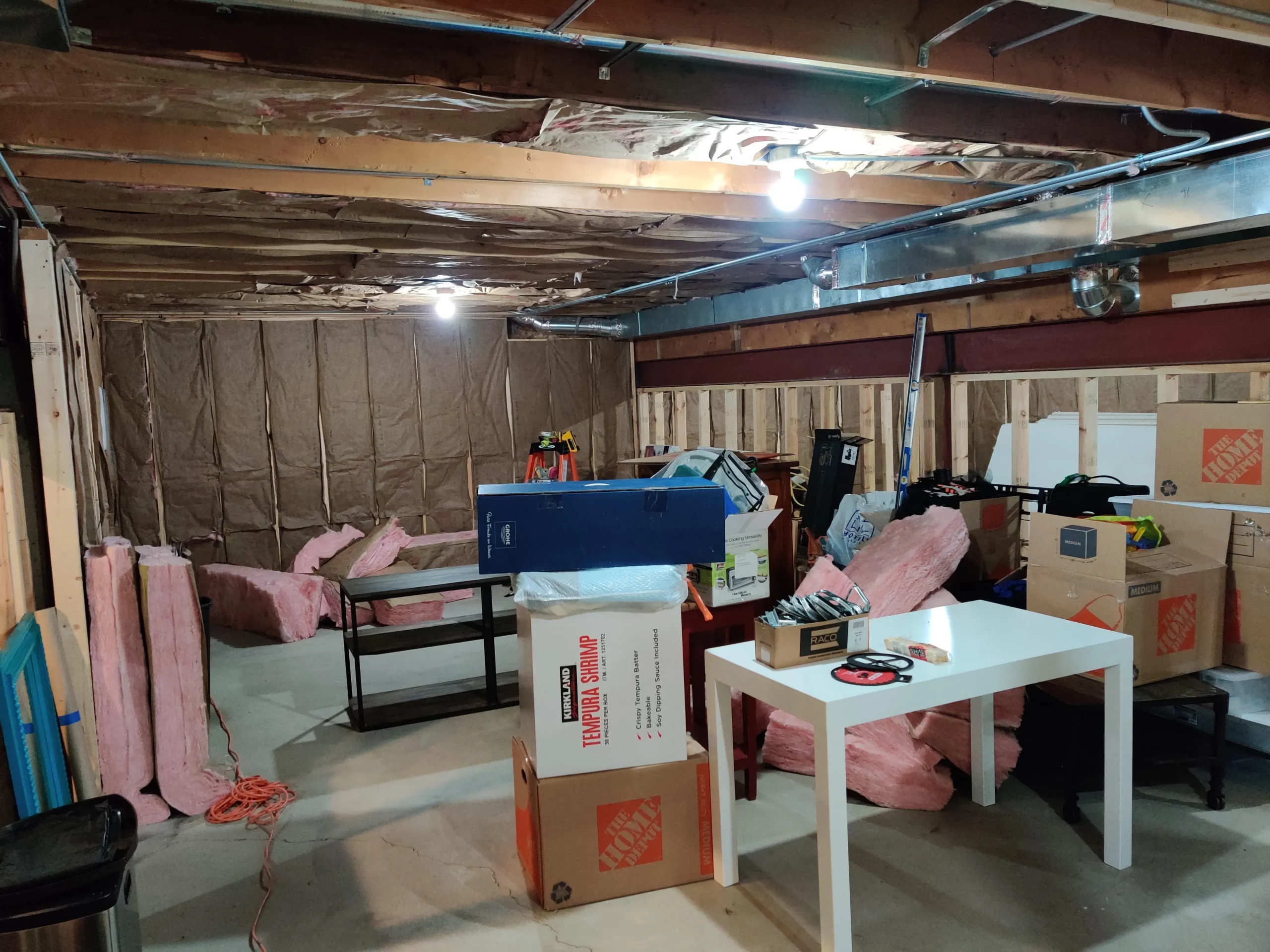 Insulation installed in the basement walls and ceiling