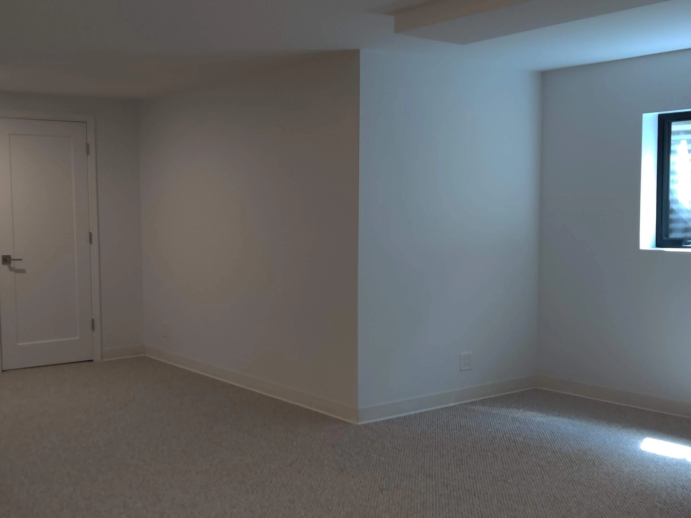 Finished Evanston basement room with painted walls, carpet, and recessed lighting