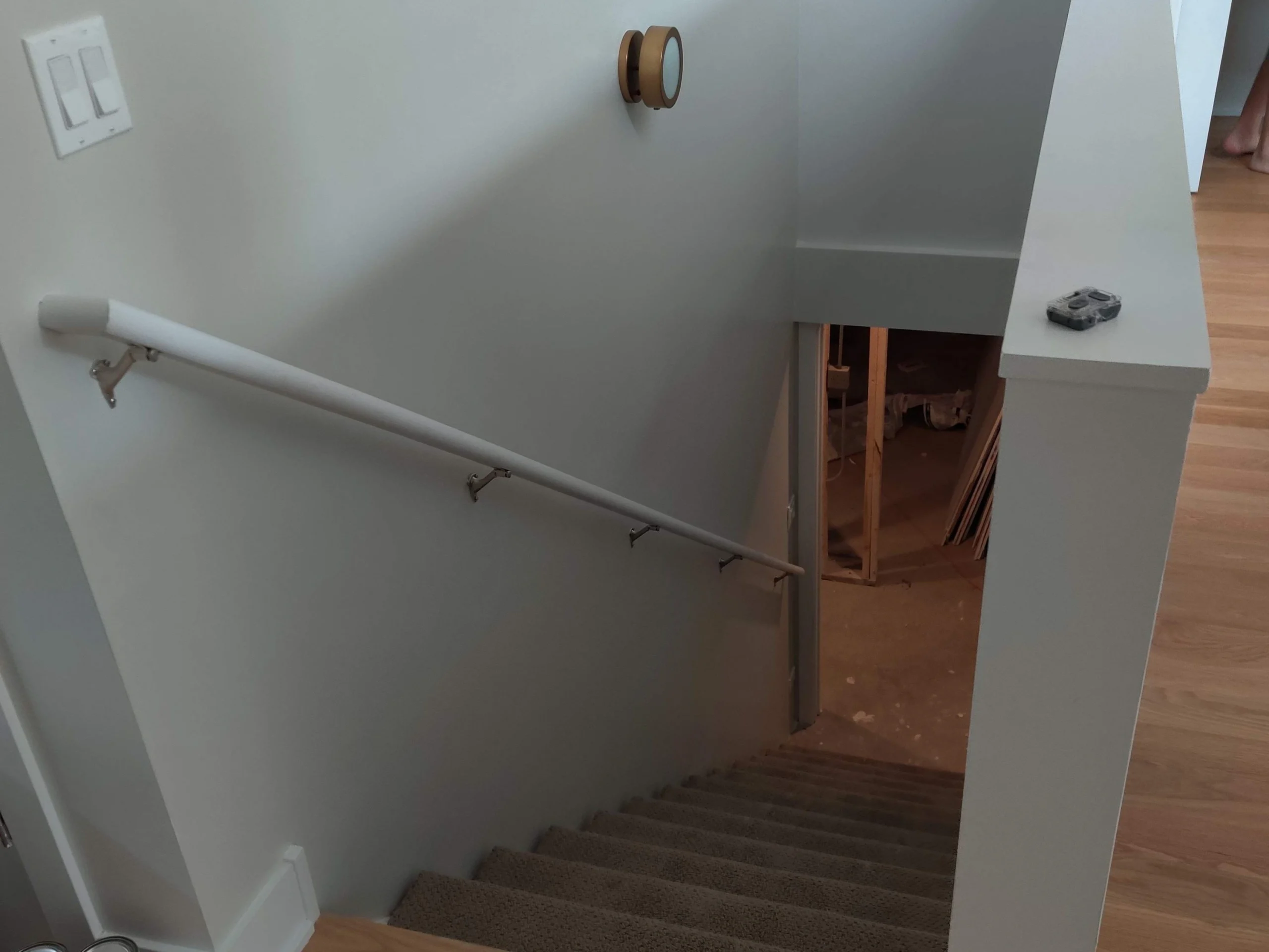 Basement stairway connecting the lower level to the main floor